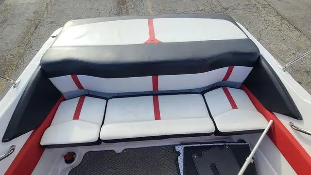 Slide: The Image of 2016 Four Winns H 180 SS boat interior with red and white seating. - 10