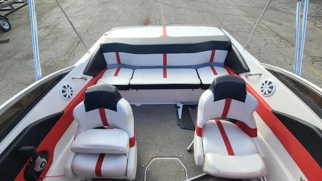 Slide: The Image of 2016 Four Winns H 180 SS boat interior with red and white seating. - 15