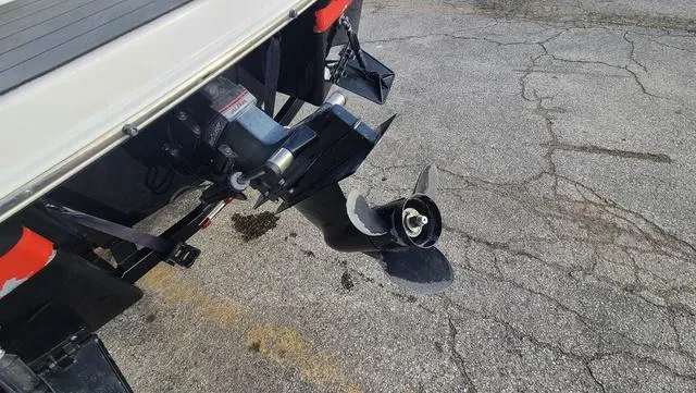 Slide: The Image of 2016 Four Winns H 180 SS boat propeller on cracked pavement. - 4