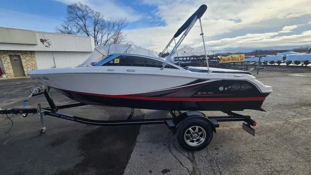Slide: The Image of 2016 Four Winns H 180 SS boat on trailer, parked outdoors. - 7
