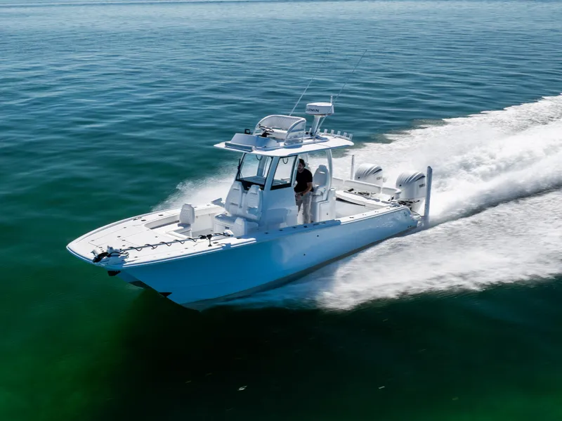 Slide: The Image of 2025 Freeman 28 boat cruising on open water, showcasing sleek design and powerful performance. - 14