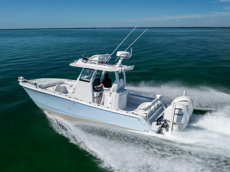 Slide: The Image of 2025 Freeman 28 boat cruising on open water, featuring sleek design and powerful engine. - 17