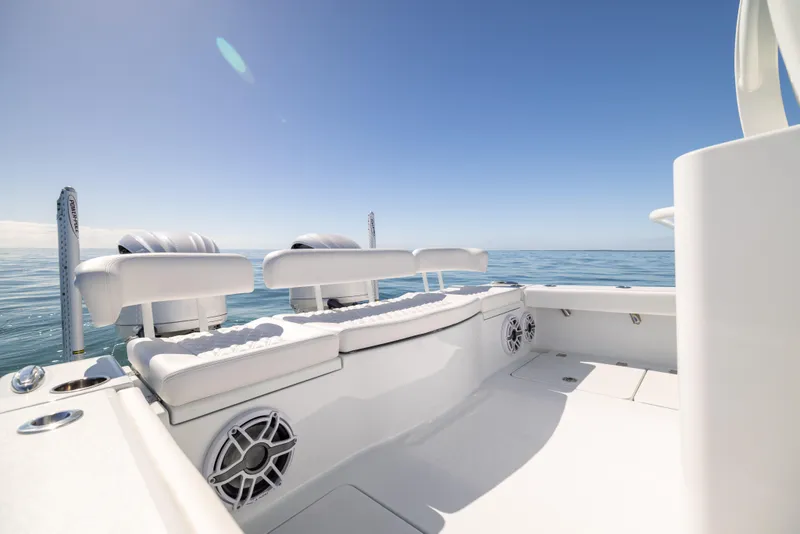 Slide: The Image of 2025 Freeman 28 boat interior with ocean view, featuring sleek seating and modern design. - 24
