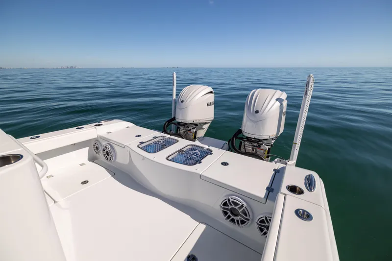 Slide: The Image of 2025 Freeman 28 boat with dual engines on calm ocean waters. - 26