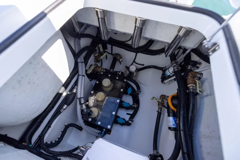 Slide: The Image of Engine compartment of a 2025 Freeman 28 boat, showcasing wiring and mechanical components. - 30