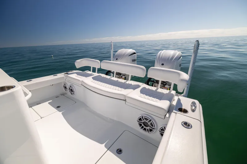 Slide: The Image of 2025 Freeman 28 boat with dual engines on calm ocean waters. - 31