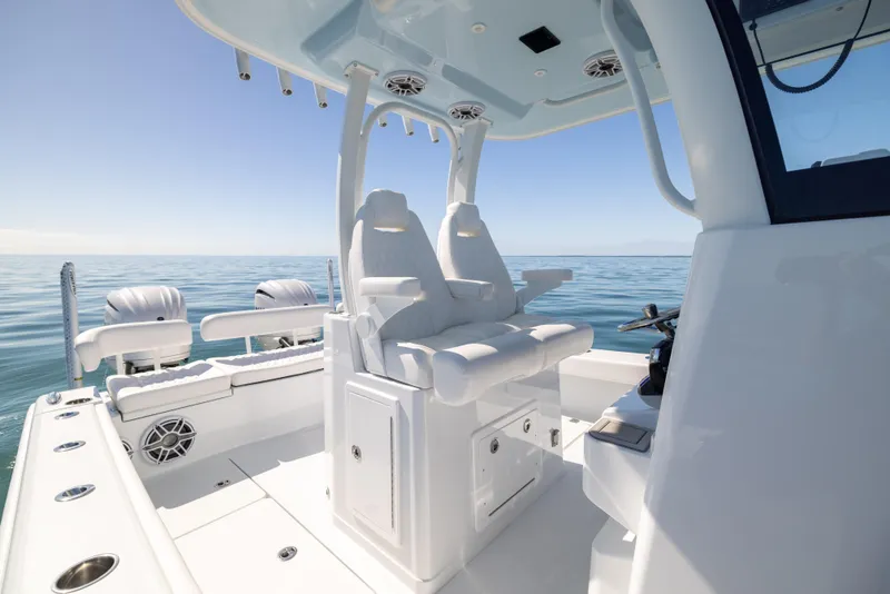 Slide: The Image of 2025 Freeman 28 boat interior with white seating, ocean view, and modern design. - 33