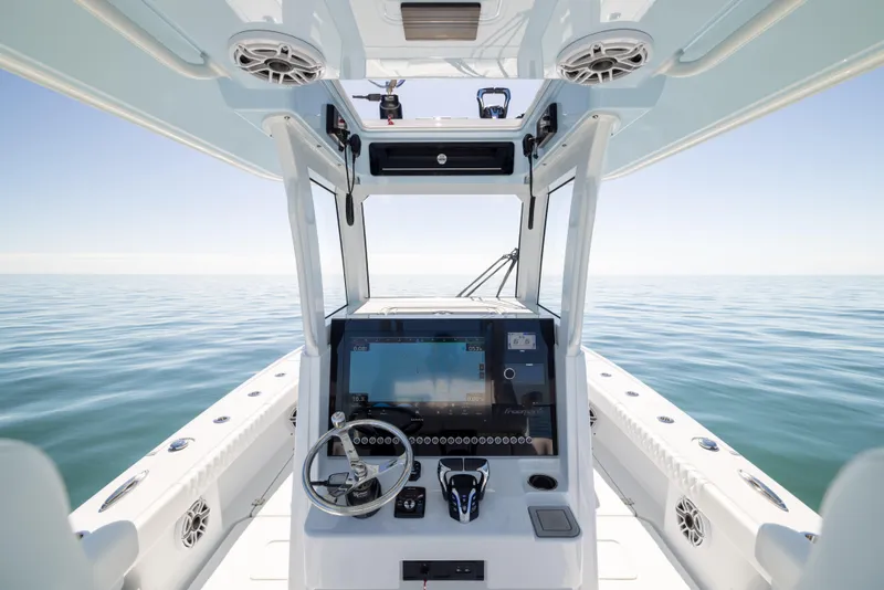 Slide: The Image of Freeman 28 boat interior, 2025 model, featuring modern helm and open sea view. - 38