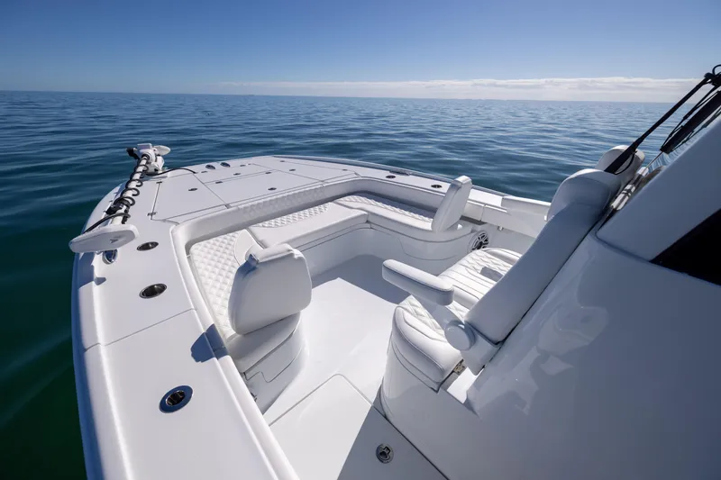 Slide: The Image of 2025 Freeman 28 boat interior, featuring sleek seating and open ocean view. - 41