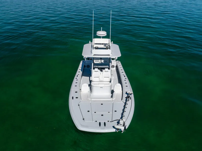 Slide: The Image of Aerial view of a 2025 Freeman 28 boat on clear green water. - 5