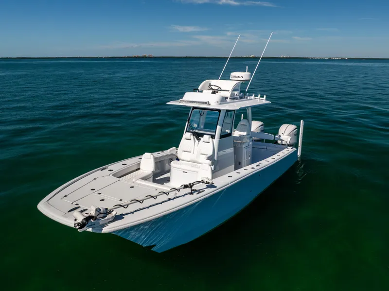 Slide: The Image of 2025 Freeman 28 boat on calm ocean waters under clear blue sky. - 8