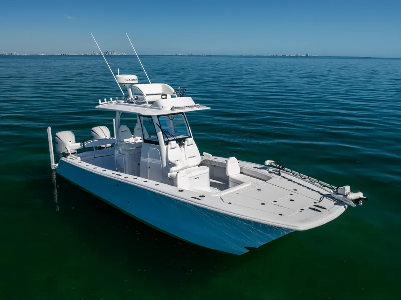 Slide: The Image of 2025 Freeman 28 boat on calm ocean waters under clear blue sky. - 9