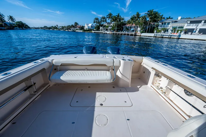 Slide: The Image of 2013 Grady-White 335 boat deck with scenic waterfront view. - 10