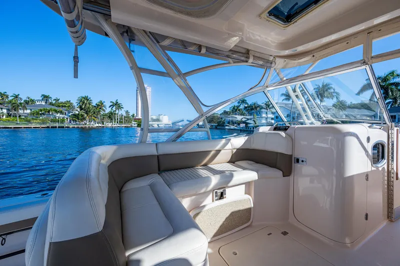 Slide: The Image of Interior view of 2013 Grady-White 335 boat with waterfront scenery. - 23