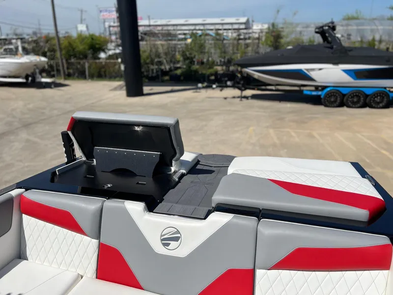 Slide: The Image of 2024 Tigé Z3 boat interior with red and gray seating, featuring a sleek design. - 15