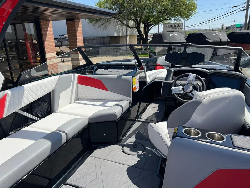 Slide: The Image of 2024 Tigé Z3 boat interior with modern seating and sleek dashboard design. - 16