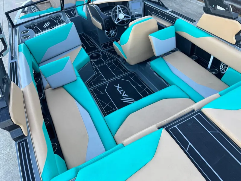 Slide: The Image of 2023 ATX Surf Boats 20 Type-S interior with teal and beige seating, modern design. - 10