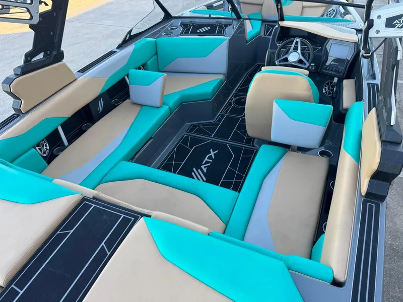 Slide: The Image of 2023 ATX Surf Boats 20 Type-S interior with teal and beige seating, modern dashboard. - 15