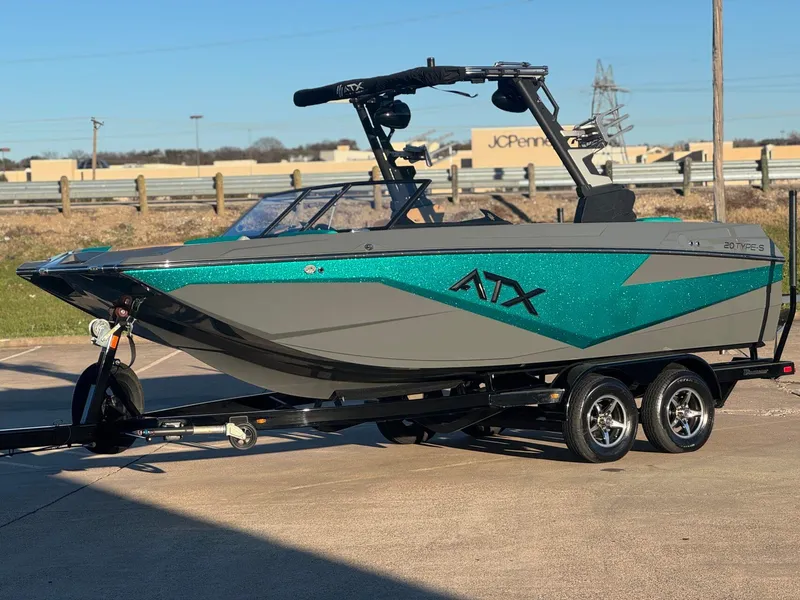 Slide: The Image of 2023 ATX Surf Boats 20 Type-S in teal and gray on trailer, parked outdoors. - 3