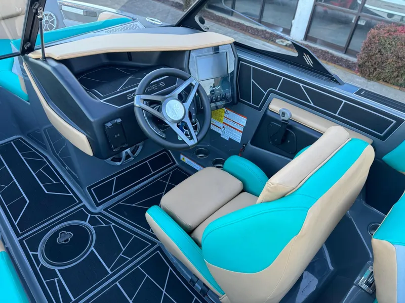 Slide: The Image of 2023 ATX Surf Boats 20 Type-S interior with teal and beige seating, modern dashboard. - 7