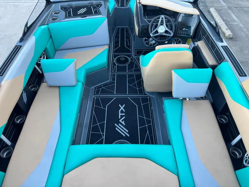 Slide: The Image of 2023 ATX Surf Boats 20 Type-S interior with turquoise and beige seating, modern dashboard. - 8