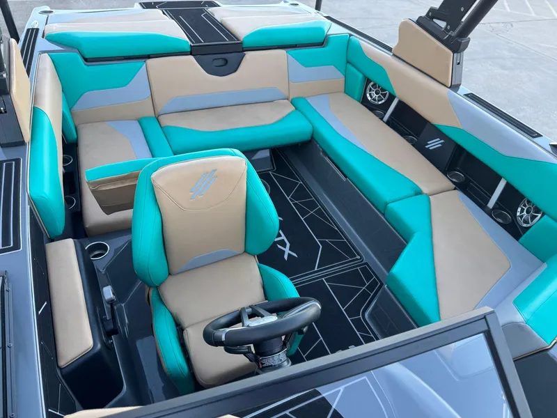 Slide: The Image of 2023 ATX Surf Boats 20 Type-S interior with teal and beige seating, modern design. - 9