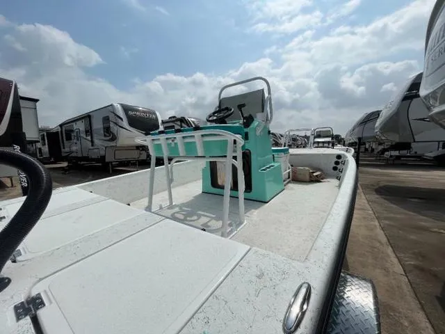 Slide: The Image of 2023 Freedom PATRIOT boat on trailer, surrounded by RVs under cloudy sky. - 14