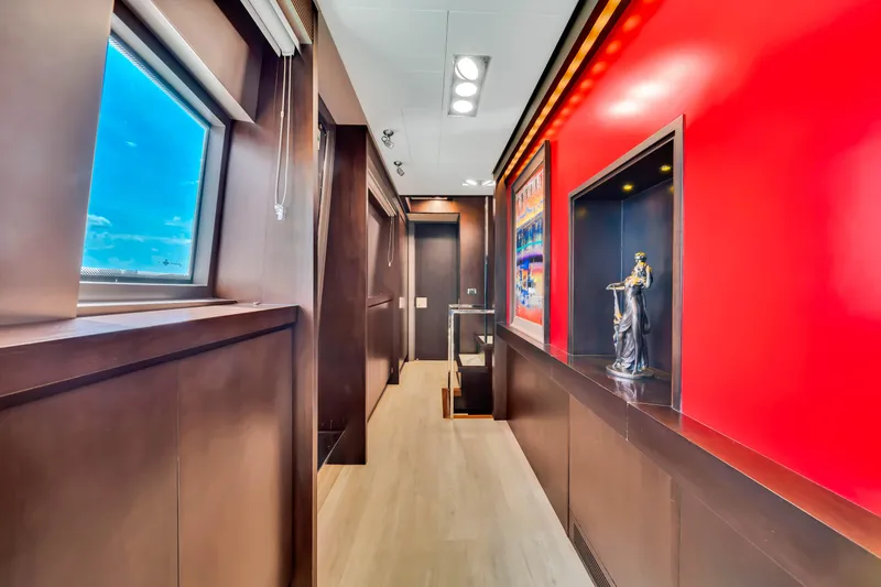 Slide: The Image of Luxurious interior hallway of 2012 Azimut 116 yacht with modern decor and vibrant red accents. - 32