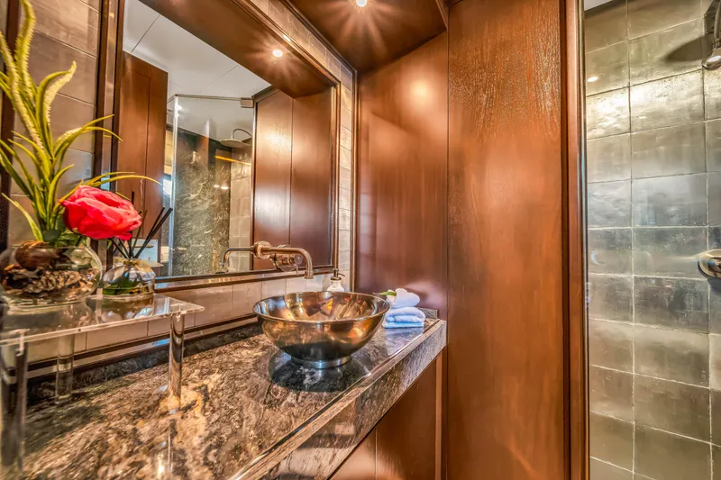 Slide: The Image of Luxurious bathroom on 2012 Azimut 116 yacht with elegant wood paneling and modern fixtures. - 33