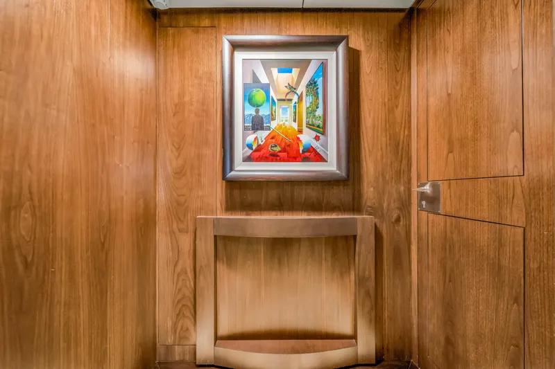 Slide: The Image of Wood-paneled interior of 2012 Azimut 116 yacht with framed artwork. - 34