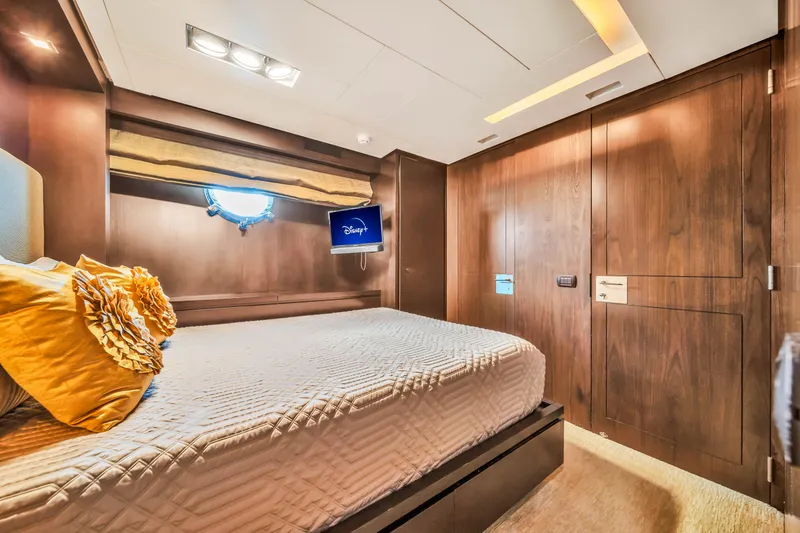 Slide: The Image of Luxurious bedroom interior on 2012 Azimut 116 yacht with elegant wood paneling and cozy bedding. - 37