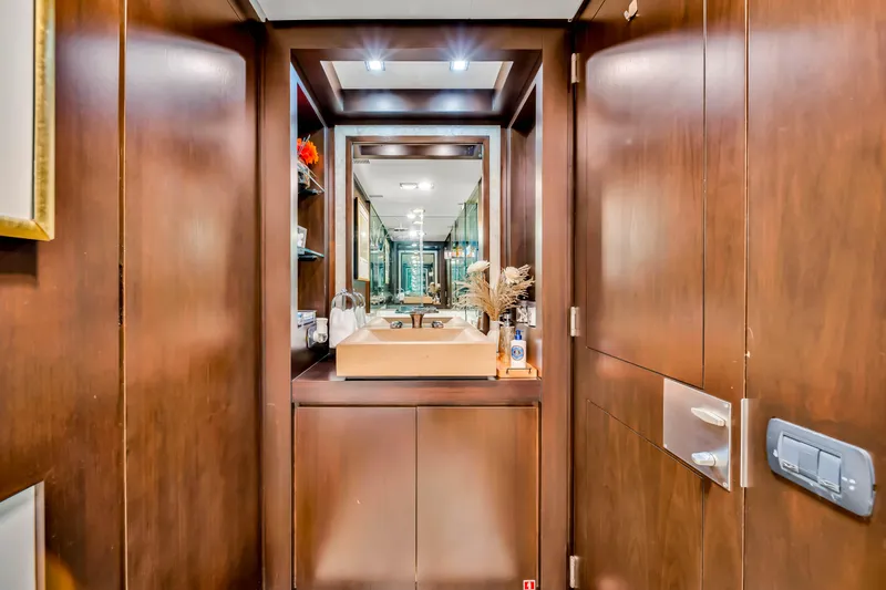 Slide: The Image of Luxurious bathroom interior on a 2012 Azimut 116 yacht, featuring elegant wood finishes. - 39