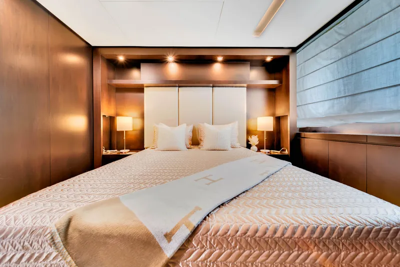Slide: The Image of Luxurious bedroom interior on 2012 Azimut 116 yacht with elegant bedding and warm lighting. - 41