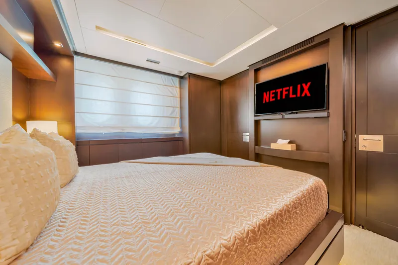 Slide: The Image of Luxurious bedroom on 2012 Azimut 116 yacht with TV displaying Netflix. - 42