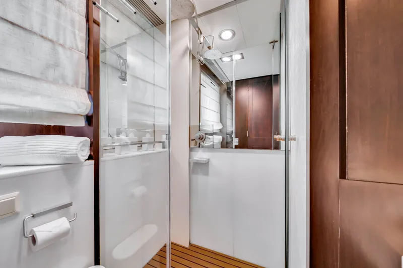 Slide: The Image of Luxurious bathroom interior on a 2012 Azimut 116 yacht, featuring modern fixtures and wooden accents. - 45