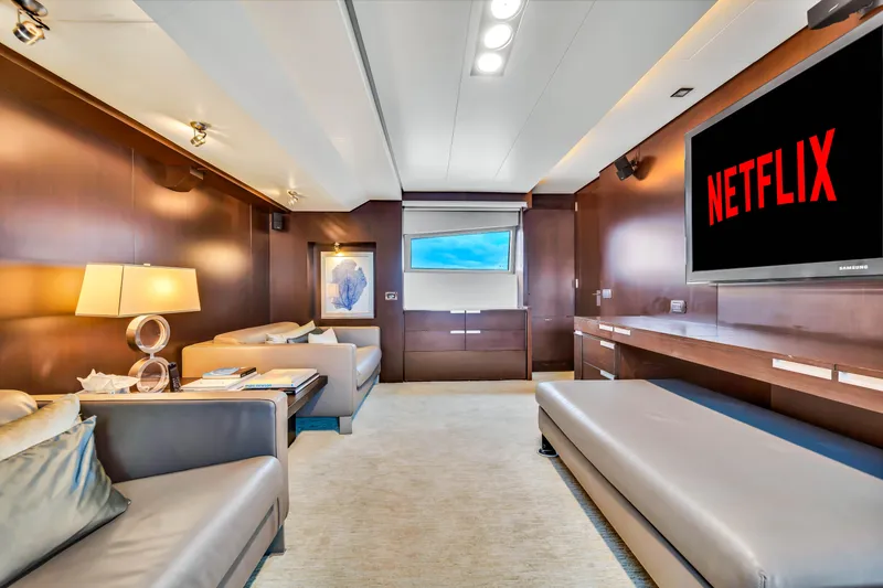 Slide: The Image of Luxurious Azimut 116 yacht interior with modern seating and large TV displaying Netflix. - 6