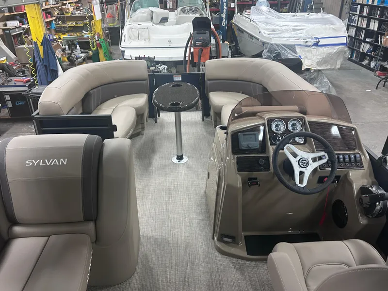 Slide: The Image of 2025 Sylvan Mirage Fish 820 Party Fish interior with plush seating and modern dashboard. - 10