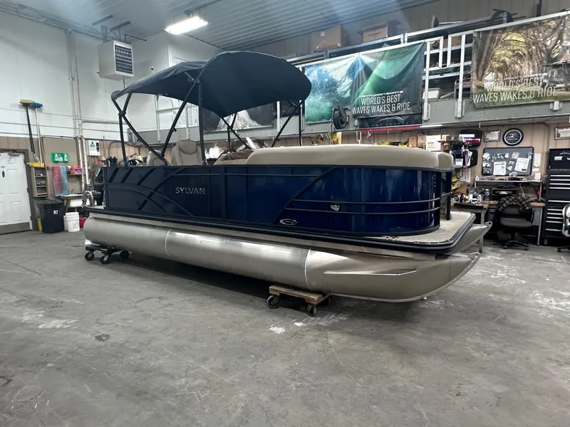 Slide: The Image of 2025 Sylvan Mirage Fish 820 Party Fish pontoon boat in a workshop setting. - 11