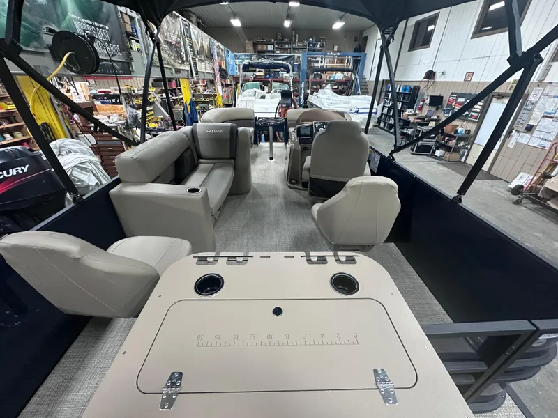 Slide: The Image of 2025 Sylvan Mirage Fish 820 Party Fish interior with seating and fishing amenities. - 14