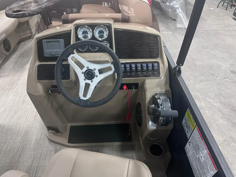 Slide: The Image of 2025 Sylvan Mirage Fish 820 Party Fish boat dashboard with steering wheel and controls. - 15