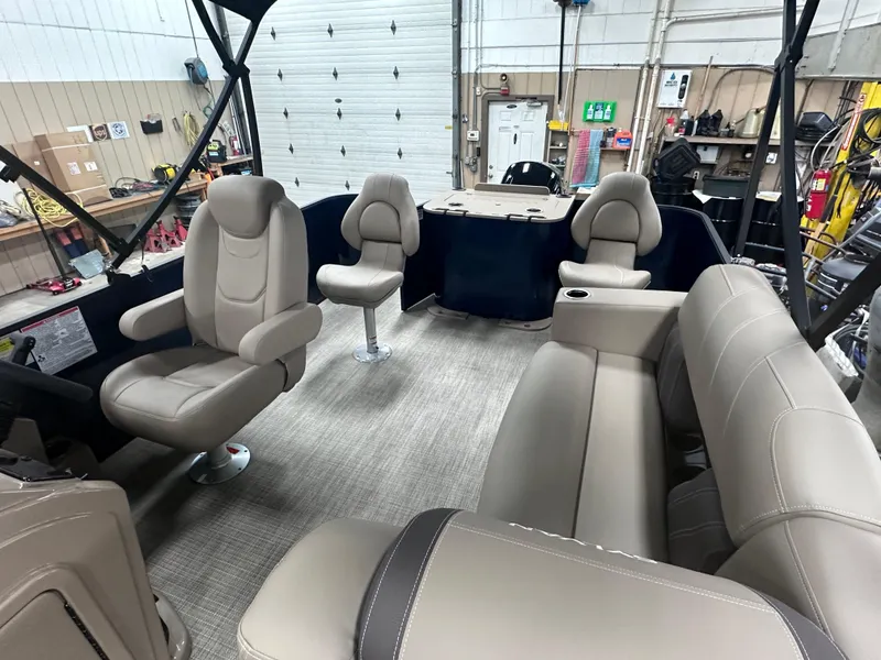 Slide: The Image of 2025 Sylvan Mirage Fish 820 Party Fish boat interior with beige seating and modern design. - 6
