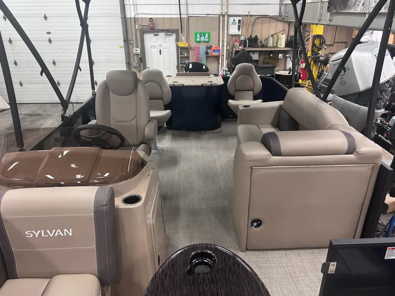 Slide: The Image of 2025 Sylvan Mirage Fish 820 Party Fish interior with beige seating and steering console. - 8