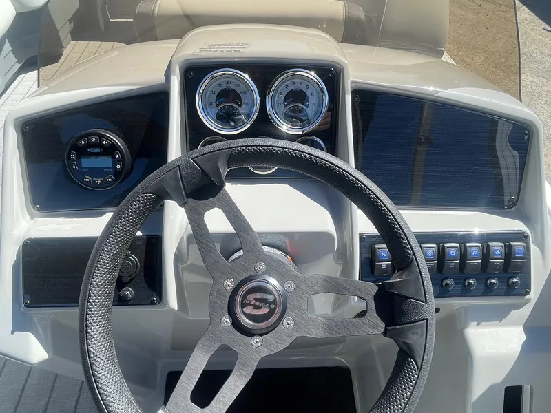 Slide: The Image of Steering console of 2025 Sylvan Mirage 818 Cruise boat with gauges and controls. - 7