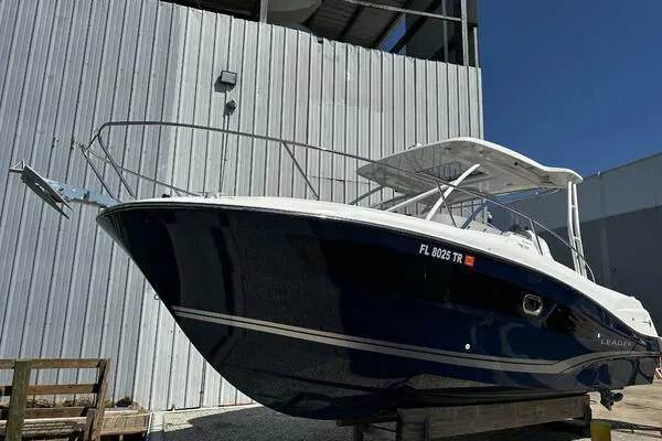 The Image of 2024 Jeanneau Leader 9.0 WA boat with sleek design, docked outdoors. - 0