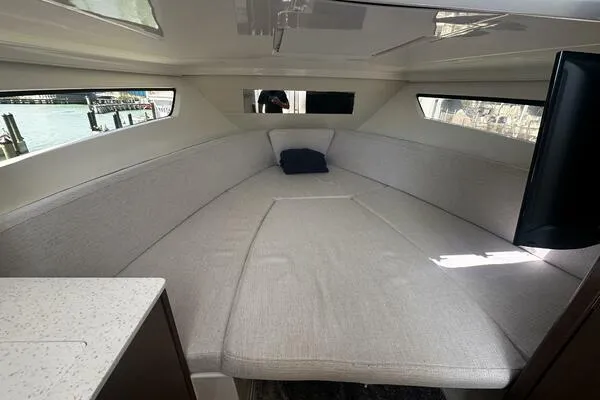 Slide: The Image of 2024 Jeanneau Leader 9.0 WA cabin interior with spacious seating and modern design. - 13