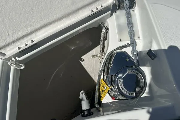 Slide: The Image of Anchor compartment of 2024 Jeanneau Leader 9.0 WA boat with winch and rope. - 20