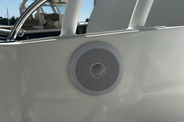 Slide: The Image of 2024 Jeanneau Leader 9.0 WA boat speaker detail, white exterior, close-up view. - 27