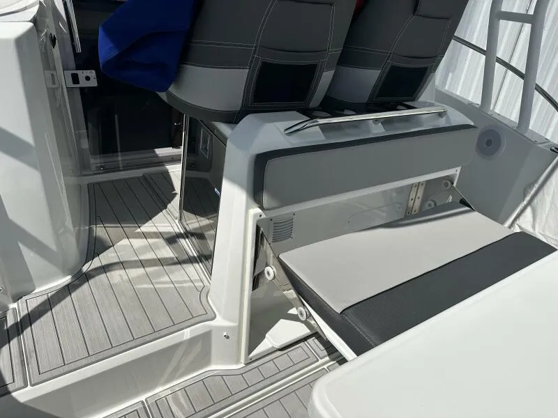 Slide: The Image of 2024 Jeanneau Leader 9.0 WA boat interior with modern seating and sleek design. - 28