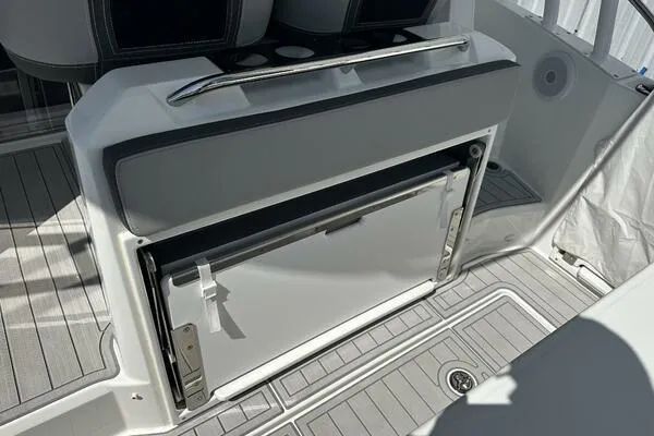 Slide: The Image of 2024 Jeanneau Leader 9.0 WA boat interior with built-in storage compartment. - 30