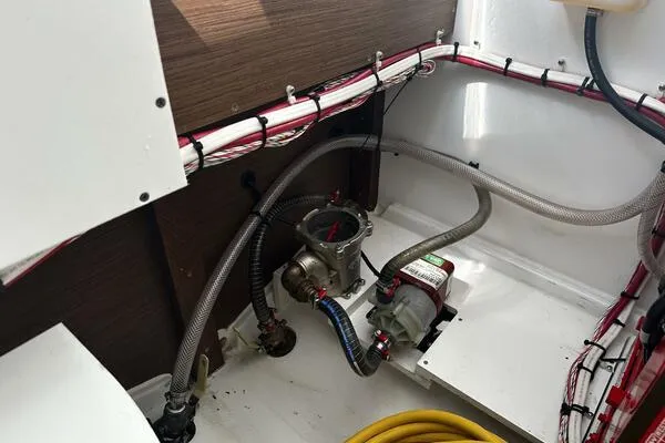 Slide: The Image of 2024 Jeanneau Leader 9.0 WA engine compartment with hoses and wiring. - 36